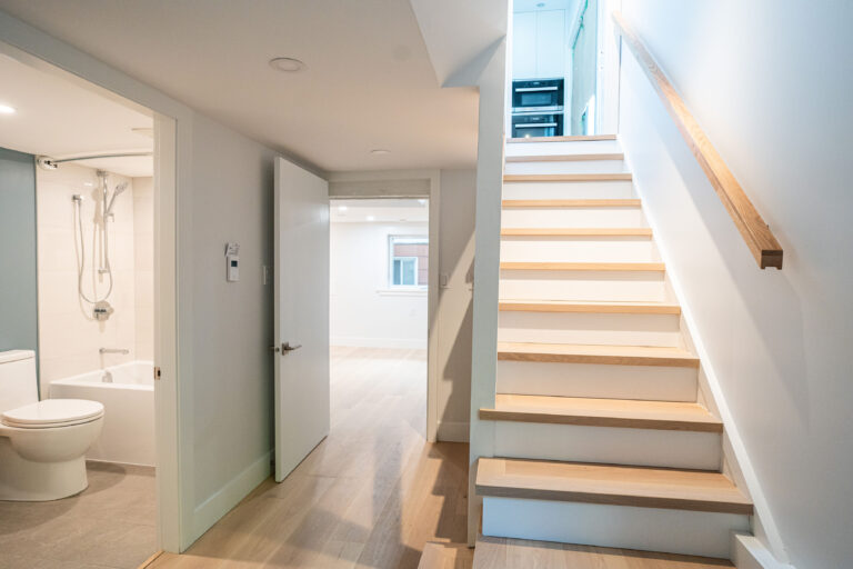 Williams St house in East Vancouver post renovation. Updated bathroom, floors, and staircase.